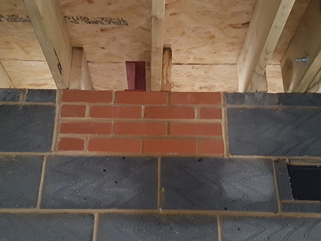Engineering brickwork under beam end